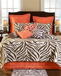 Expedition Quilt - Come on Safari with us with this fun ensemble of Zebra and Giraffe patterns. Rich shades of chocolate brown and apricot add a wonderful bold and refreshing look in any room. Decorative pillows include exotic skin looks.