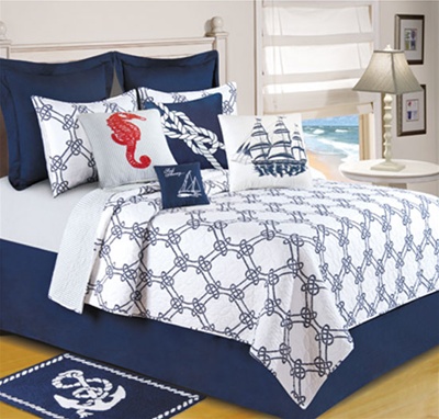Knotty Buoy - Ahoy! Get ready to set sail with this nautical themed quilt ensemble. The quilt features a navy on white knotted rope design that reverses to a blue pin stripe. Decorative pillows with ships, seahorses and rope patterns compliment the beddi