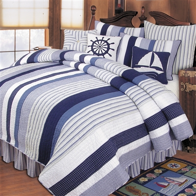 Nantucket Dream - Ahoy! Get ready to set sail with this nautical themed quilt ensemble. A beautiful ensemble in blue and white, the Nantucket Dream quilt collection features nautical stripes and decorative pillows with images of ships wheels and sailboats