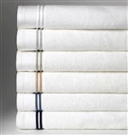 Indulge in softness and simplicity with this 100% combed cotton towel made in Portugal. These towels woven from the finest cotton, provide superior absorbency and feature a double row of woven striped border..