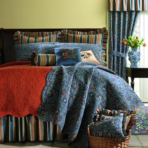 Wakefield Quilt - A Colonial WilliamsburgÂ® Foundation design of classic beauty. Richly colored ornate leaves, flowers and scrolling vines in shades of terracotta, burgundy and green on an indigo blue ground. A coordinate