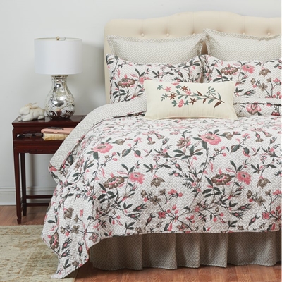 A Colonial WilliamsburgÂ® classic toile design of classic beauty. The quilt has vinning leaves and delicate flowers in pink, tan and green. The quilt reverses to a geometric print of tan on white which is repeated on the Euro Sham.
