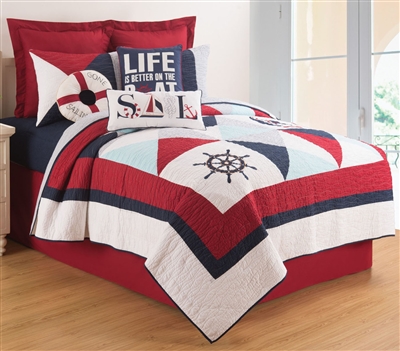 Original nautical theme quilt with detailed applique and embroidery. A crisp palette of navy and red and light blue on a cream background. Quilts are oversized for todayÂ¹s high profile mattresses.