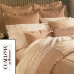 Sloane features magnificent embroidery on a silk like background in dusty peach. The duvet cover is fully embroidered and has a 100% cotton sheet fabric backing. Pillow shams and bedskirts are a coordinate pinstripe of the same color