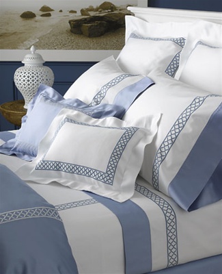 An example of Alhambra embroidery on Seurat matelassÃ© and Milano sheeting with contrasting cuff and Duvet Cover in Nocturne Azure.