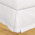 Hotel Stripe Bedskirt - Elegant three line stripe embroidery design of high luster satin yarn. Machine washable, 100% cotton with split corners to accommodate footboards. 18" high bedskirts can be used under 14" bedskirts to create stylish layered looks.