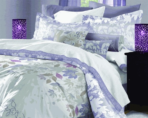 Jasmine Tea combines a floral panel print design with a delicate embroidered floral etched design at the base of the bed. A spring like blend of flowers in lavender, plum and taupe are spread over the crisp white ground, perfect for today's color scheme.