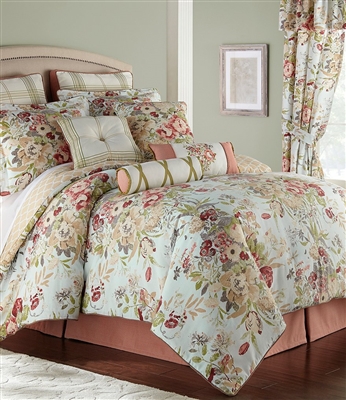 Enhance your room with this elegant English floral. Beautiful multicolored floral bouquets of red, pale gold, taupe and green on a pale blue ground. The oversized comforter reverses to a quatrefoil design in pale gold.
