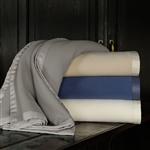 Olindo Blanket by Sferra, is woven from the rarest and most extraordinary Merino lambswool in all of Australia, known for its supreme comfort and warmth. Each generously sized Olindo blanket is finished with fabric-bound hems .