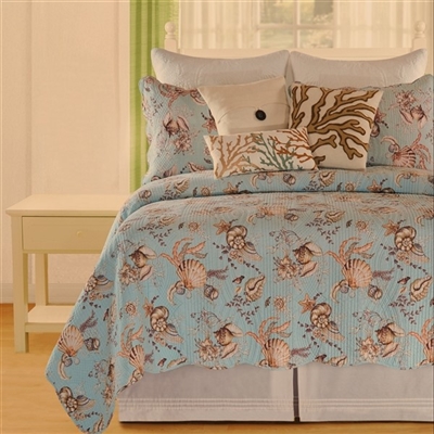Under the Sea,  A print of seashells and sea flora will add a relaxing and tranquil feeling to  to any bedroom.The quilt features a scalloped edge, and is covered with a pattern of shells and sea plants in coral and tan on a soft aqua ground.