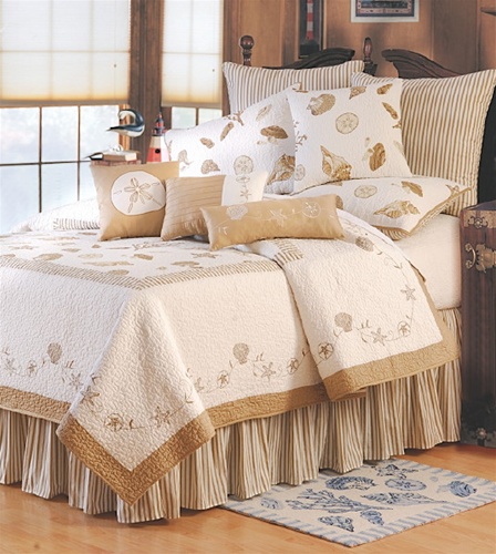 Embroidered sea shells and starfish surround the center panel print of this lovely quilt. The background is 100% cotton in bone white with taupe accents and border. The Euro shams and