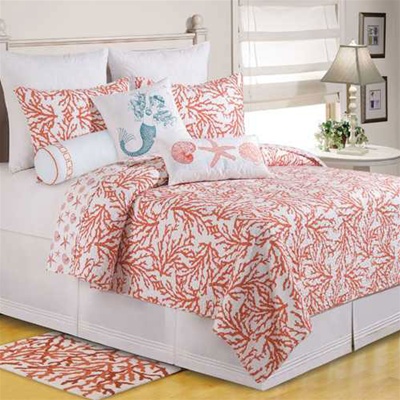 Cora- A crisp white ground serves a the ground for this coral reef that would look great in your coastal home or beach house. The quilt reverse has starfish, shells and sand dollars