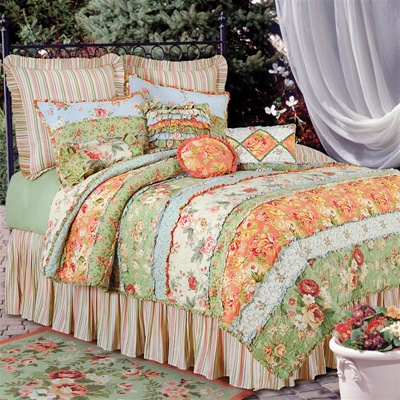 Garden Dream-
Bring the garden into your bedroom with this brightly colored floral design.
Horizontal bands of flowers decorate the quilt with colors of green, pink, berry, and coral on a cream ground.