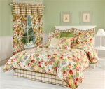 Blanchette- Over-flowing garden flowers typical of Antibellum southern plantations. Lavish bouquets of fragrant flowers in shades of red, yellow, blue, green and pink spill out onto the bone white background. Matching window curtains, valances pillows