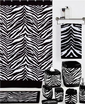 A striking black and white ensemble that will create an exotic look in any bathroom. The shower curtain is 100% polyester and is machine washable. Decorative accessories include ceramics with solid black borders around the top and bottoms of each piece.